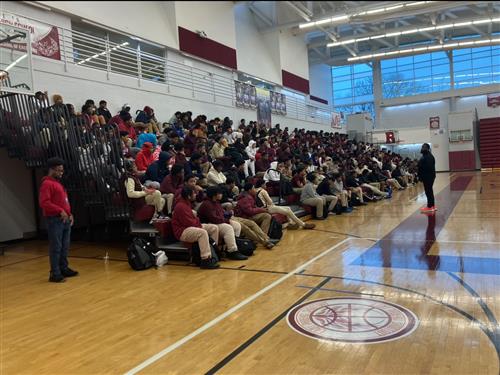 Speaker speaking with RHS Students in gymnasium